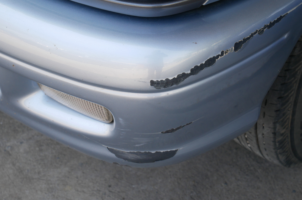 Scratches and paint damage on a car bumper